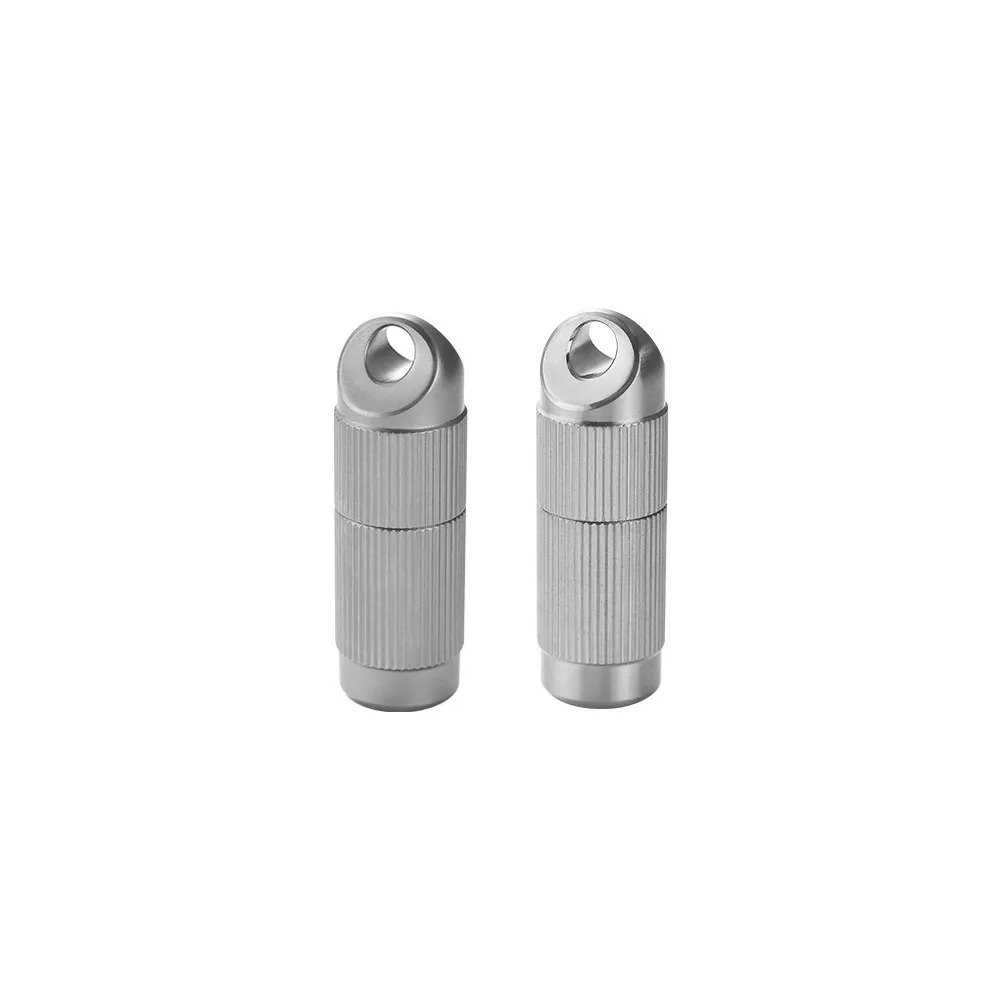 Two views of a cylindrical titanium storage capsule with knurled grip