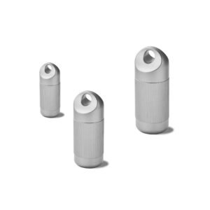Three pure titanium storage capsule sizes with knurled bodies